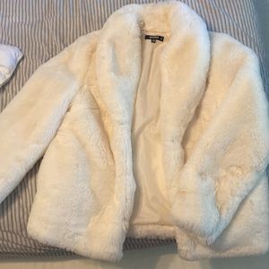 White faux fur coat